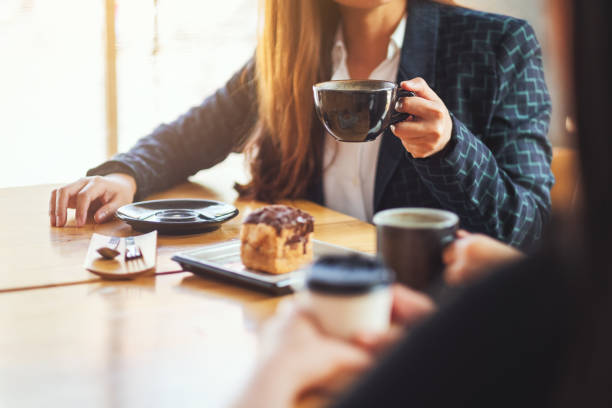 istock people enjoyed talking, eating and drinking coffee together in cafe 1213831498