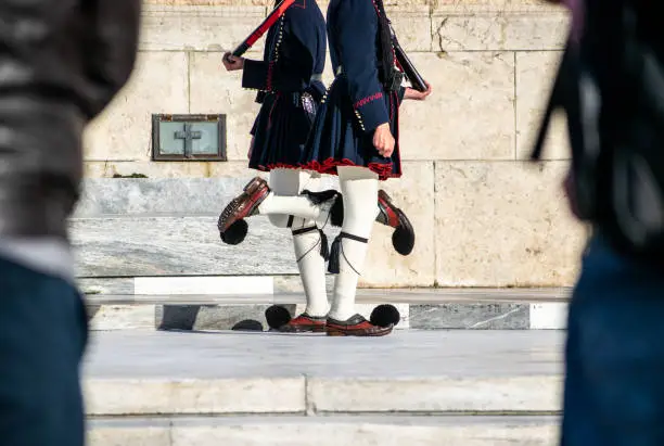 Close up of two presidentials guards holding their rifles at the Syntagma square of Athens.
