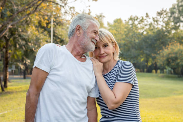 istock Senior couples hug each other and smile happily. 1213834064