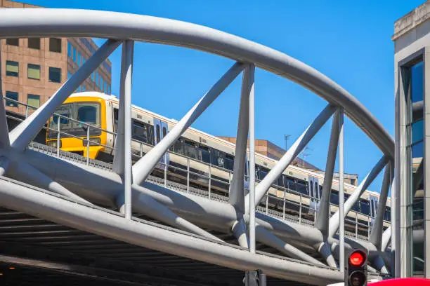 Photo of Railway overpass with a train leaving from London Bridge station in London