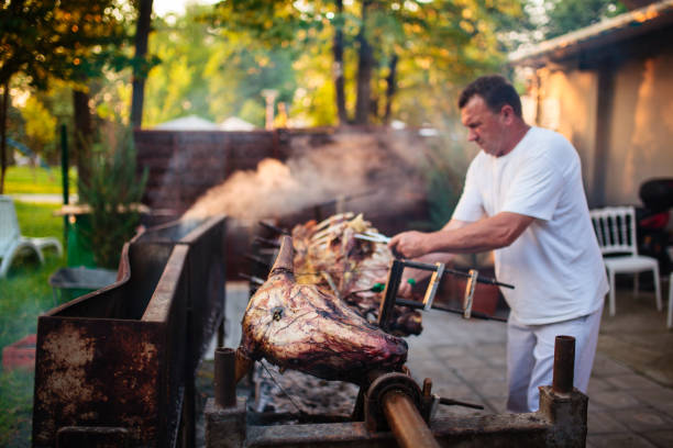 istock Almost done whole cow on a rotisserie 1213835800