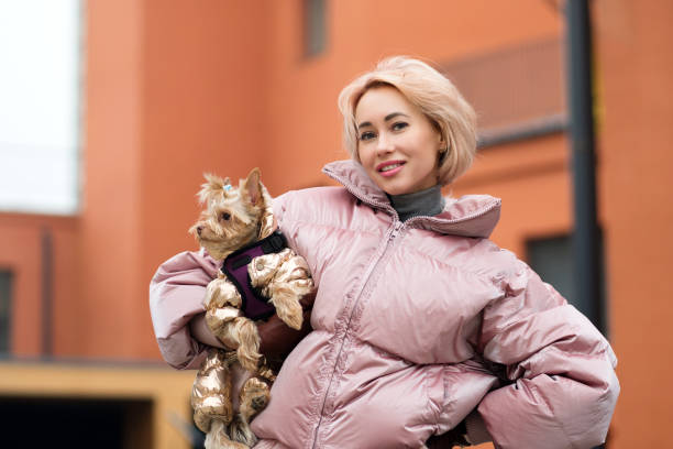 istock Girl walks with a dog 1213838406