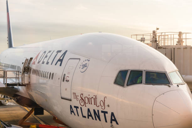 Atlanta, Georgia, United States - December 31, 2015 : Delta airplane parked at the International Airport of Atlanta . Image taken at dusk
