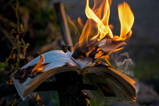 Burning book. Book with pages in flames. Conceptual image for culture, knowledge. book burning stock pictures, royalty-free photos & images