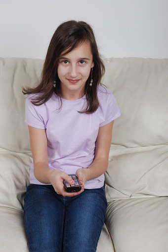 Girl with TV remote control