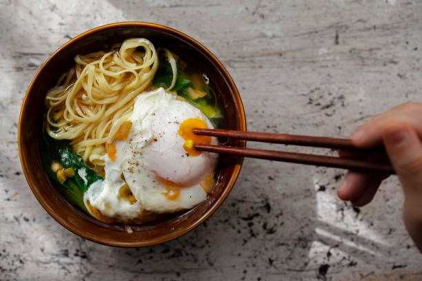 istock Chinese homemade noodles, poached egg and vegetables 1213840215