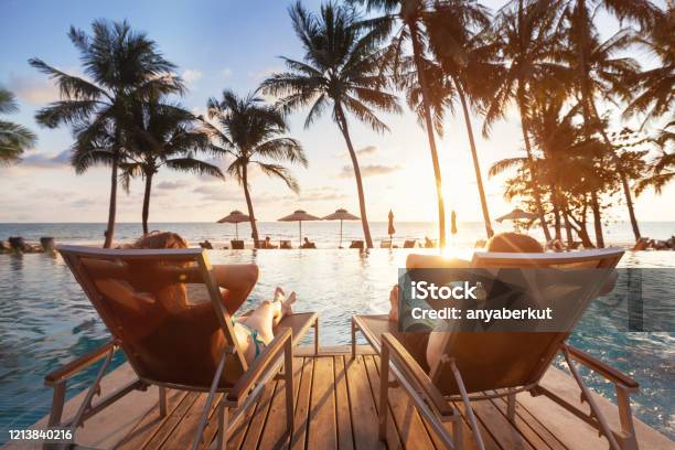 Luxury Travel Romantic Couple In Beach Hotel Stock Photo - Download Image Now - Vacations, Beach, Hotel