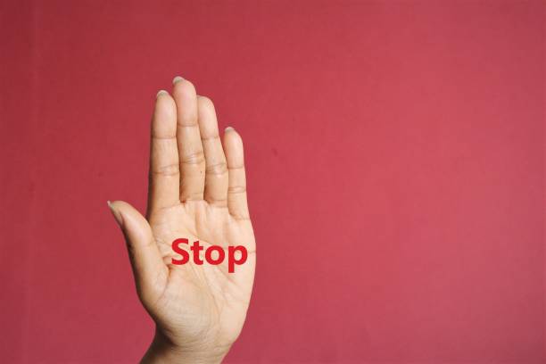 Stop text on women palm photo stock photo