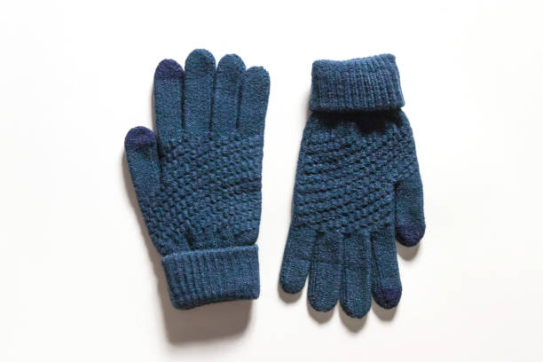 istock Dark blue knitted touch screen gloves isolated on white background. 1213840848