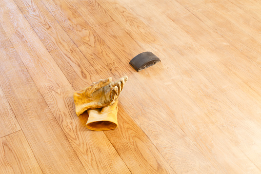 Sanding a floor with a sanding block, home improvement DIY project, UK