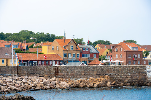 Svaneke, Bornholm / Denmark - July 29 2019: View of the small town of Svenek in Bornholm from accross the bay