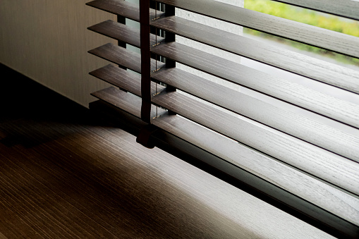 wooden window blind with daylight texture background