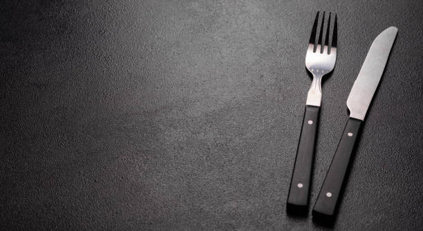 istock Set of tableware ready for the meal with black copy space 1213845784