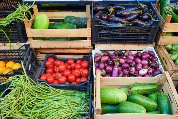 istock Fresh vegetables in wooden boxes 1213848936