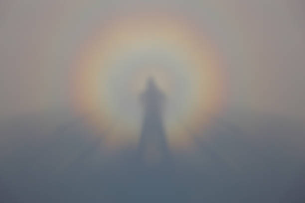istock Rainbow shrouded silhouette of a human body reflected in mist 1213855611