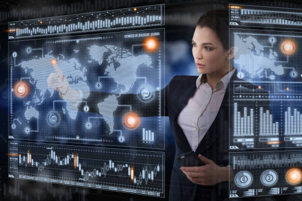istock Young business lady works with virtual graphic interface in futuristic office 1213857277