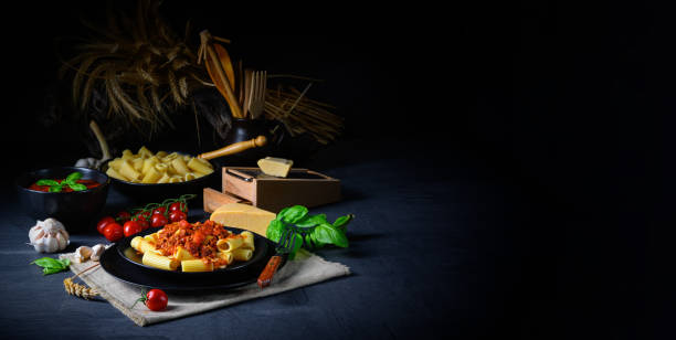 istock Rigatoni pasta with Bolognese sauce and fresh basil 1213859216