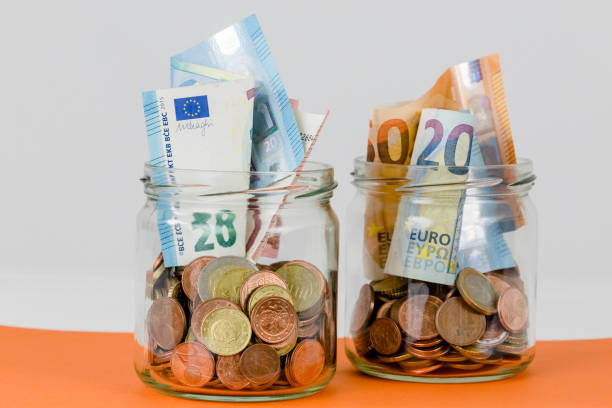 istock money in the glass 1213860108
