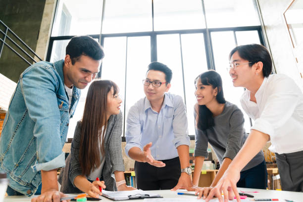 istock Successful Business people having a workshop brainstorm together sharing laptop paper document discussion office background 1213860271