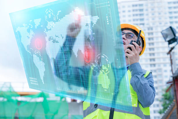 istock front view of professional engineer asian male safety helmet manage control constuction site with expertise working with virtual monitor screen system control 1213860300