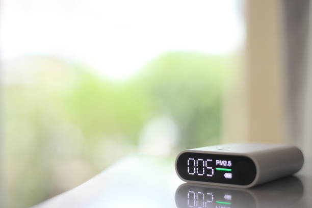 istock PM 2.5 dust detector and green bokeh background. 1213860634