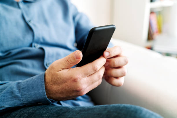istock Businessman working at home using with smart phone 1213860881
