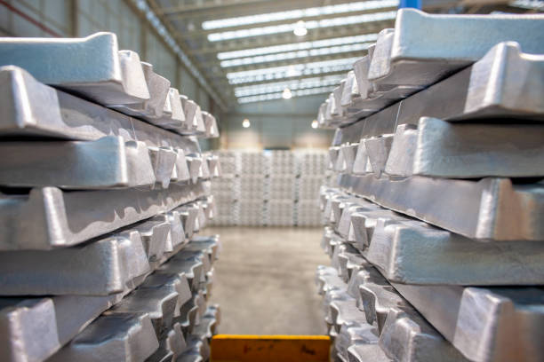 istock Freshly molded aluminum ingots stacked on pallets, ready for distribution. 1213862778