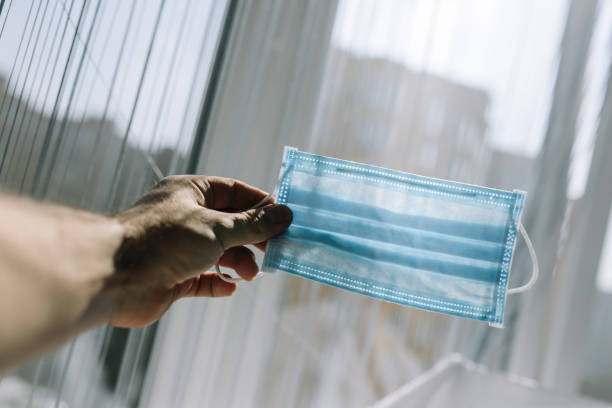 istock Medical mask in man hand. Virus protection 1213864528
