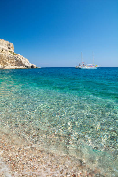 crystal clear water of mediterranean sea on Afandou beach on Rhodes island in Greece amazing beach on Rhodes island in greece afandou stock pictures, royalty-free photos & images