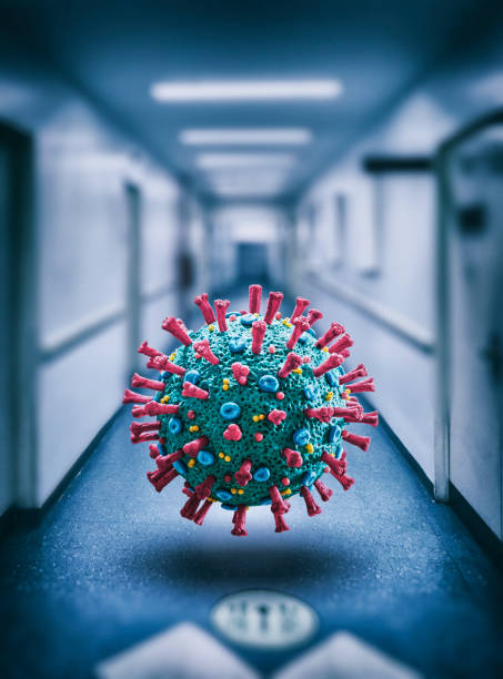 istock Corona Virus COVID-19 floating microscopic macro mockup in hospital 1213868778