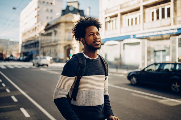 istock Young man ridding electric scooter 1213868833