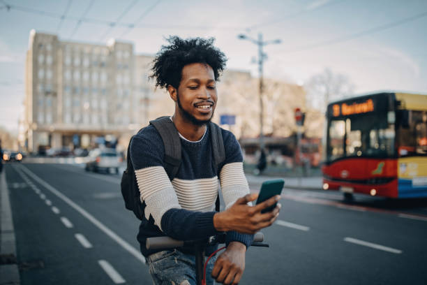 istock Young man ridding electric scooter 1213869402