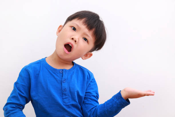 istock Little Asian boy showing his palm over white background 1213870319