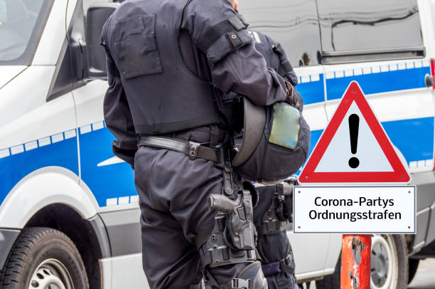 istock Administrative penalties Corona parties Shield in german 1213870429