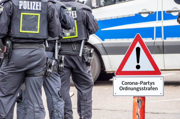 istock Administrative penalties Corona parties Shield in german background 1213870431