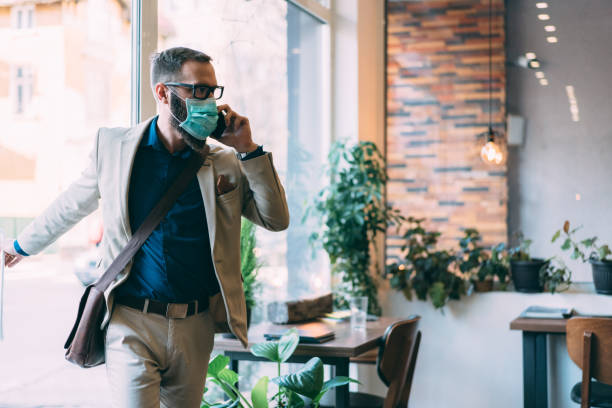 istock Businessman with protective mask during COVID-19 1213871719
