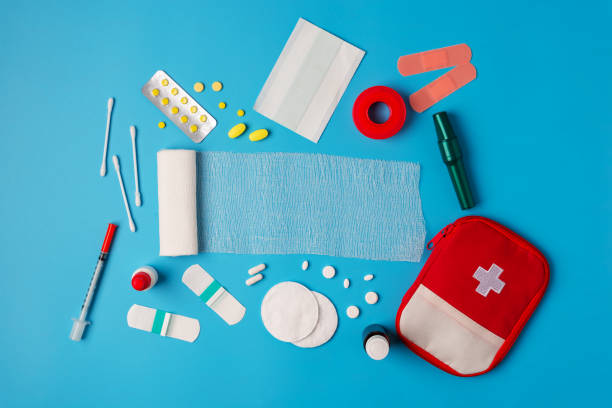istock Flat lay Medicines and devices for first aid, bandages, painkillers, plaster, cotton wool, tampon on a blue background 1213872829
