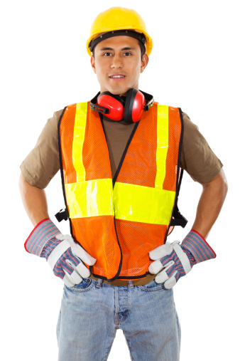 Stock image of male construction worker standing confident isolated on white background