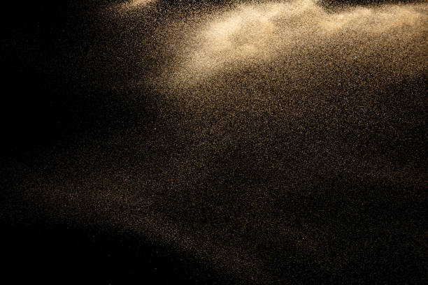 istock Brown colored sand splash.Dry river sand explosion isolated on black background. Abstract sand cloud. 1213874519