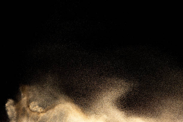 istock Brown colored sand splash.Dry river sand explosion isolated on black background. Abstract sand cloud. 1213874521