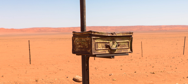 Old an rusted mailbox in the namib desert, namibia