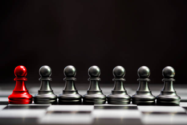 istock Red pawn chess with others black pawn chess for leader and different thinking.Disrupt concept. 1213877174