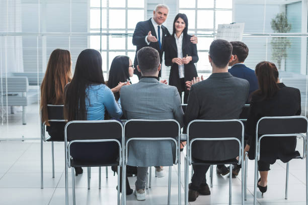 istock boss representing a young specialist during a work meeting. 1213877208