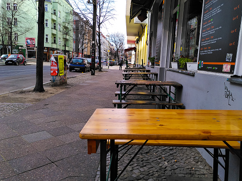 Deserted outdoor chairs and tables from a street restaurant in Friedrichshain, a Berlin neighborhood known for its nightlife, during coronavirus shutdown in Germany.