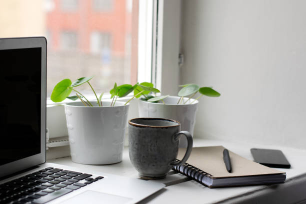istock Remote work with laptop, cup of coffee and notebook 1213878168