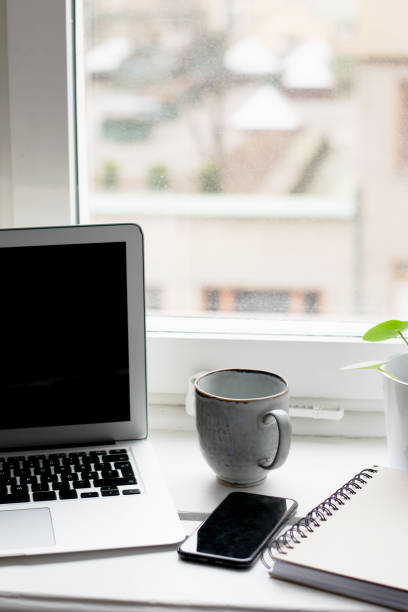 istock Office view with laptop, mobile phone, cup of coffee and notebook 1213878173