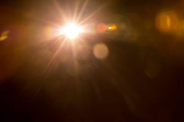 istock Abstract Natural Sun flare on the black 1213878618