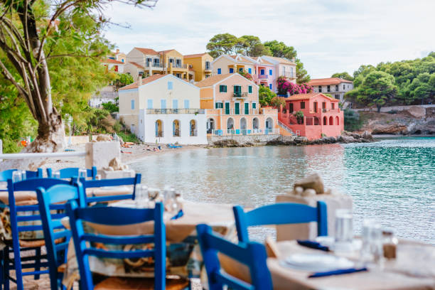 Table in Greek tavern in Assos fishing village, Kefalonia island, Greece Table in Greek tavern in Assos fishing village, Kefalonia island, Greece. zakynthos stock pictures, royalty-free photos & images