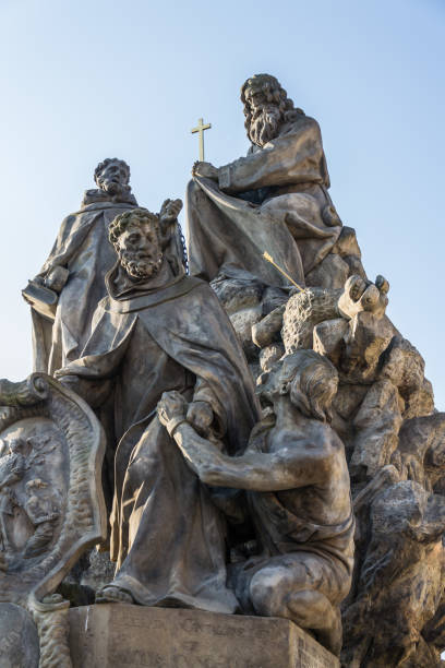 baroque sculpture of john of matha, felix of valois and saint ivan on the charles bridge, prague, czech republic, sunny day - john deer imagens e fotografias de stock