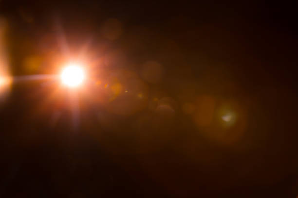 istock Abstract Natural Sun flare on the black 1213879542